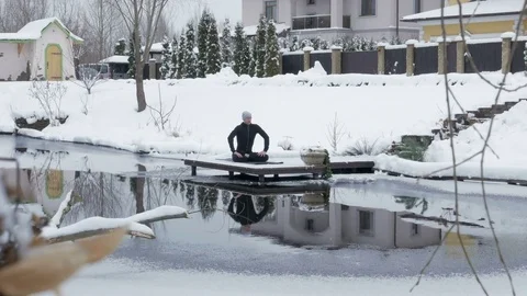 Winter yoga session. Man in black Video stock 83916829