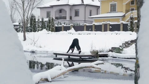 Winter yoga session. Man in black Video stock 83916846