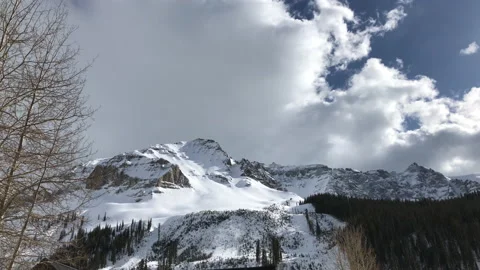 WinterCloud mountains Sun Snow Pine Tree Video stock 156941859