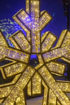 WinterFest glowing snowflake light creating a winter wonderland 库存照片
