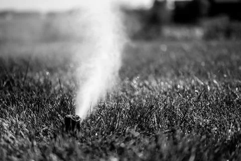 Winterizing a irrigation sprinkler system by blowing pressurized air through to Foto stock