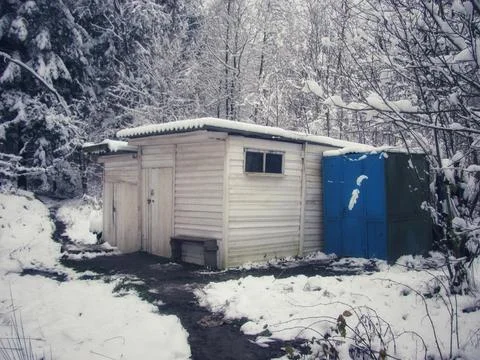 Winter's touch on a rustic shed Stock Photos