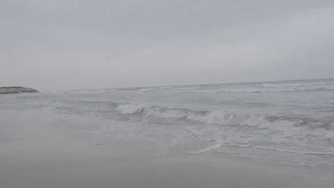 Wintertime and cloudy choppy sea, beachside in rough sea LOG VİDEO Stock Footage 230179161