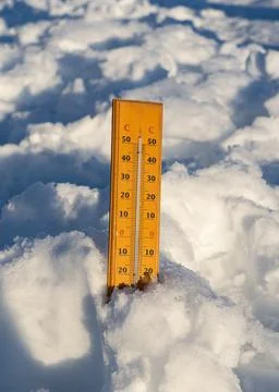 Wintertime. Winter background with thermometer in the snow on frosty day Stock Photos