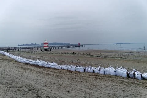 Wintry beach at dusk Stock Photos