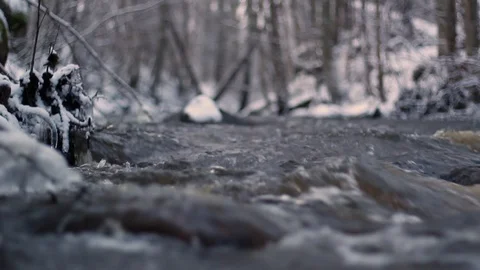 Wintry river flows fast after a spring thaw Stock Footage 126594829