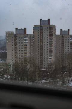 Wintry Soviet era panel apartments with stairwell spines and chimneys Stock Photos