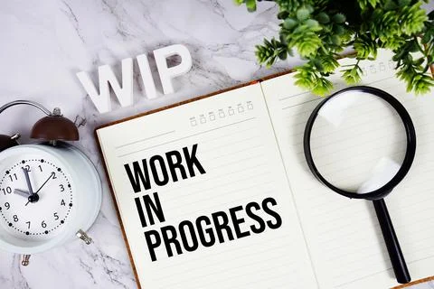 WIP - Work In Progress acronym on notepad, Business concept background Stock Photos
