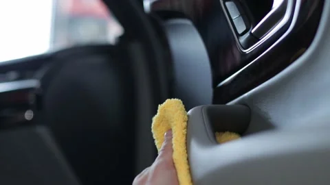 Wipe and polish leather seats from dust and dirt. Professional auto cleaning Video stock 144556853