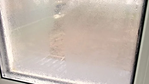 Wipe off condensation on the window. Selective focus. Stock Footage 257202534