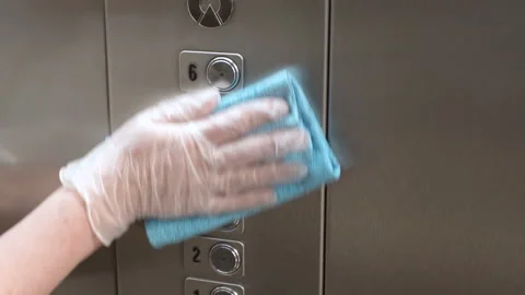 Wipe the elevator buttons with a special solution Stock Footage 130262966