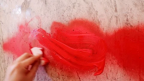 Wipe off excess paint after drawing graffiti with a napkin Stock Footage 126053528