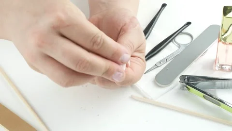 Wipe hands and nails with a damp cloth.On the table manicure tools. 스톡 동영상 136652114