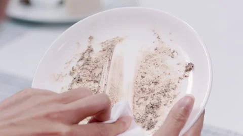 Wipe left over cream on Dish Slowmotion 1 Stock Footage 242829664