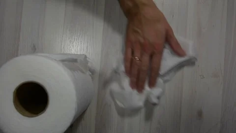 Wipe the light floor with a paper towel. View from above 스톡 동영상 123714227