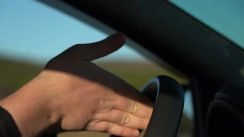 Wipe the steering wheel of the car with a damp cloth. Stock Footage 167931249