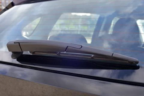 Wiper on the back windshield of a passenger car Stock Photos