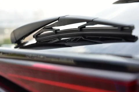 Wiper on the back windshield of a passenger car Stock Photos