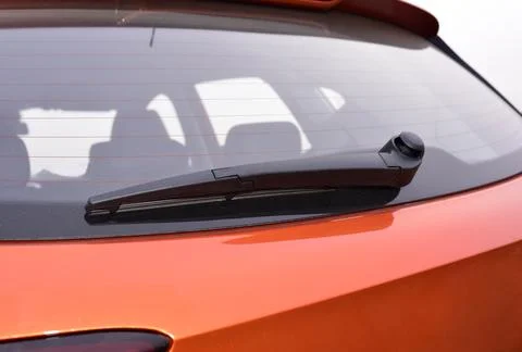Wiper on the back windshield of a passenger car Stock Photos