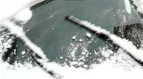 Wiper blade clearing snow Stock Footage 59583546