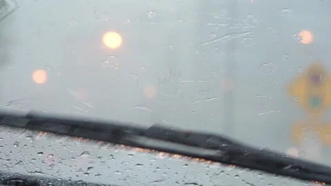 Wiper blade remove rain from windshield Stock Footage 246408144