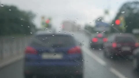 Wipers clean the windshield of the car on the go during heavy rain. Inside Video stock 139455220