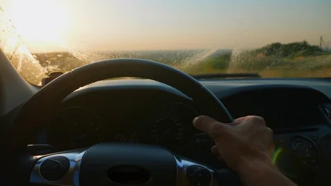 Wipers cleaning a dirty car windshield with cleaner Stock Footage 111471519