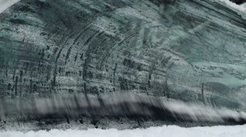 Wipers cleaning an icy windshield Stock-Footage 69058127