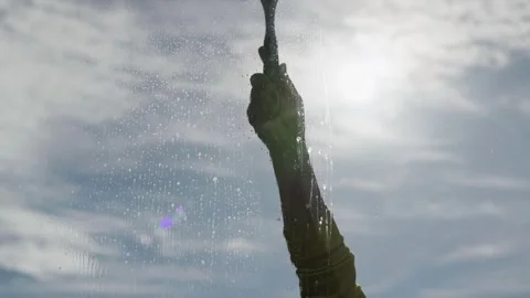 Wiping Cleaning Solution with Window Squeegee Stock-Footage 348069663