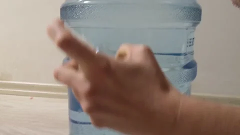 Wiping down surface of bottle Stock Footage 130348568