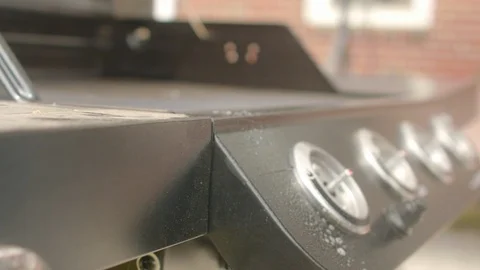 Wiping Front of Grill with Knobs Off SLIDE RIGHT 動画素材 107016296