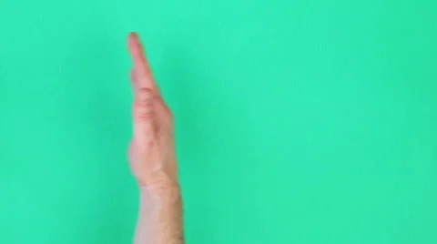 Wiping Green Screen Surface with Hand Stock Footage 64228130