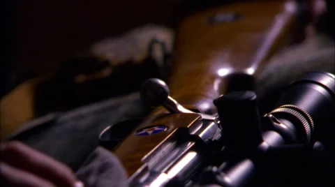Wiping Gun from Bottom to Top Stock Footage 62654540