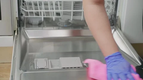Wiping the inside of dishwasher Stock Footage 91030541