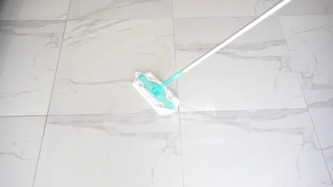 Wiping the marble floor with a mop Stock Footage 257503494