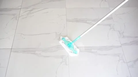 Wiping the marble floor with a mop Stock Footage 257503510