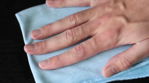 Wiping with a microfiber rag Stockbeeldmateriaal 71071378