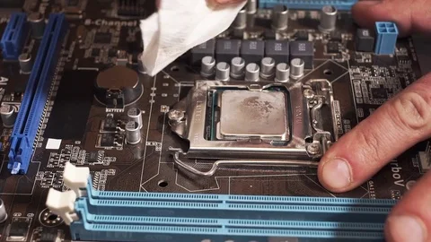 Wiping a Processor from the Old Thermal Grease Stock Footage 72679770