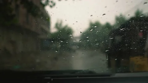Wiping rain drops on the car windshield Stock Footage 138735044