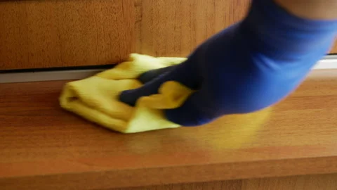 Wiping a shelf of a compatment wardrobe Stock Footage 147653884