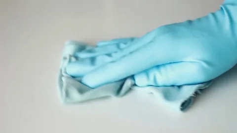 Wiping white table with microfibre duster Vídeos de archivo 77185113