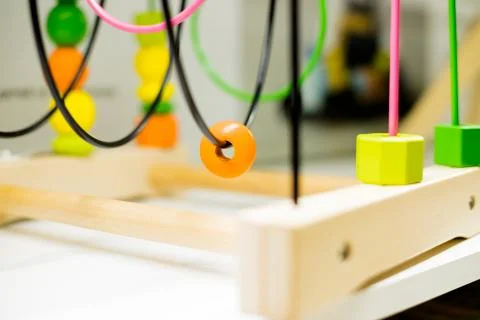 Wire bead maze standing on a table. Kid activities.Colorful Educational Toy Stock Photos