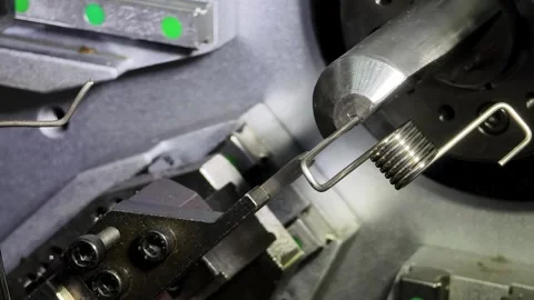 Wire bending machine in action showcasing precision engineering and automated Stock Footage 310535727