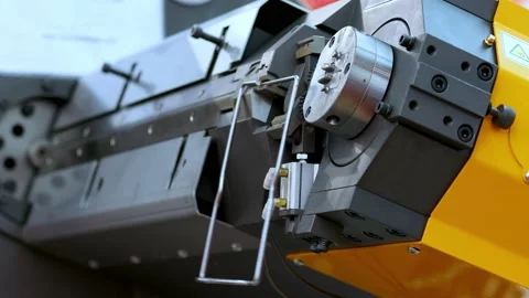 Wire bending machine. CNC metal processing. Automated metalworking machine. Stock Footage 195307565