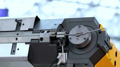 Wire bending machine. CNC metal processing. Automated metalworking machine. Stock Footage 195307639