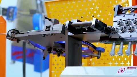 Wire bending machine. CNC metal processing. Automated metalworking machine. Stock Footage 195307770
