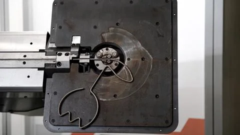 Wire bending machine. CNC metal processing. Automated metalworking machine. Stock Photos