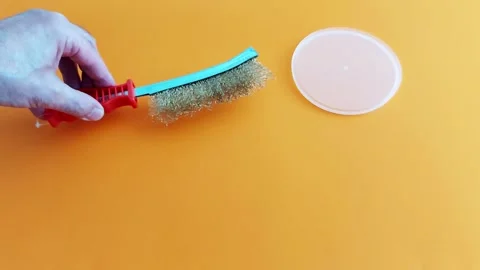Wire Brush on Plastic: DIY Cleaning Tip for Surface Maintenance Stock Footage 312733427
