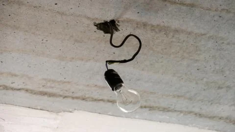 Wire, bulb, temporary lighting during the repair Stock Photos