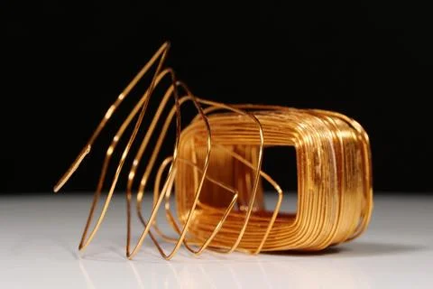 Wire from copper winding of electric current transformer Stock Photos